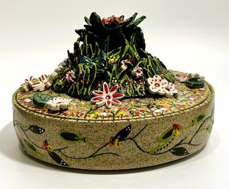 Speckled clay base. Lidded bowl. Hand painted tropical themed appliques and side details. White glaze interior. H-4in x Diameter-7 7/8in.