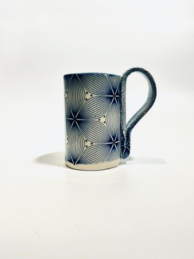 White clay base. Geometric decal design. Hand built. Cobalt glaze interior. H-4 5/8in x Diameter-3in.