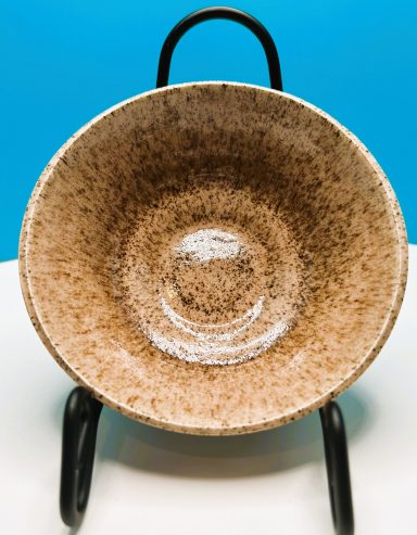 Speckled clay body. Simple bowl with celadon glaze. H-2in x Diameter-5 1/8in.
