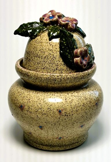 Speckled clay body lidded vessel. Hand painted details. 3D flower hand painted appliques. Lavender glaze interior. H-6in x W-4.5in.
