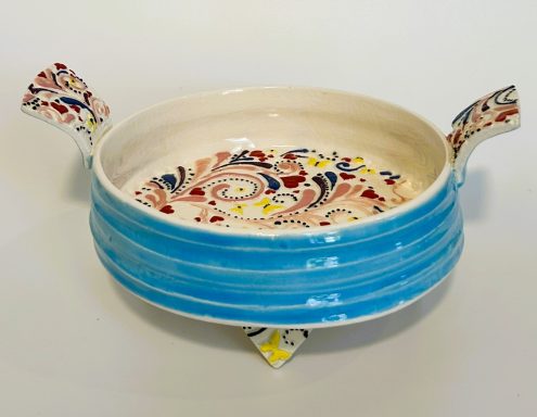 White clay base. Textured hand platter with handles and heart feet. Hand painted. H-3in x Diameter-6 3/8in.