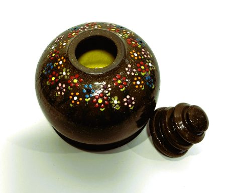 Dark brown clay body. Hand cut lid off the hump. Hand painted floral detailing. Yellow glazed interior. H-4.5in x W-4in.