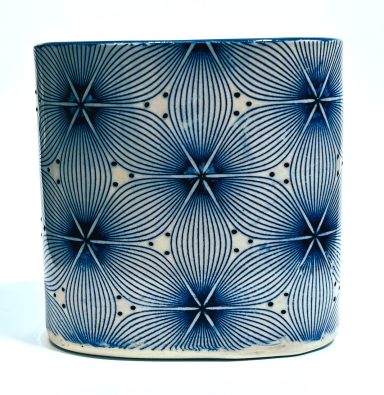 White clay body with embellished geometric decal work. Cobalt glaze interior. H-5 3/8in x W-6in.