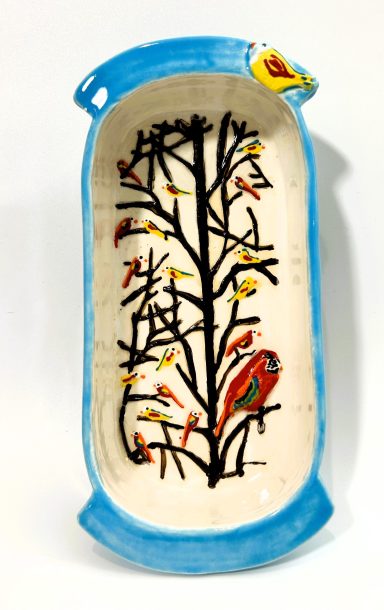 White clay base with hand painted etched details. Sky Blue external glaze. Measurements: L-9 in. x W-4 in.  