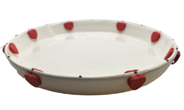 White clay base, hand painted and glazed with hand painted heart appliqués. Measurements: D-9.5in.