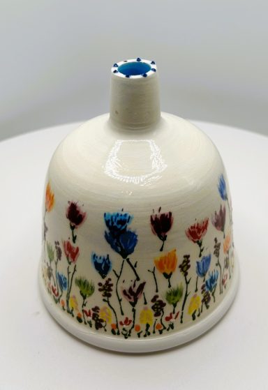White clay base. Hand painted details. Wheel thrown. Water and weather safe. Measurements: D-4in x H-4.25in.